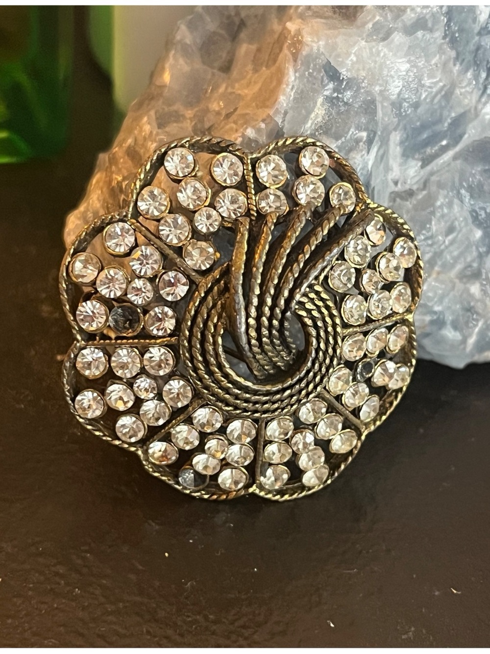 Vintage Kramer of New York Flower rhinestone brooch with gold-tone swirl design